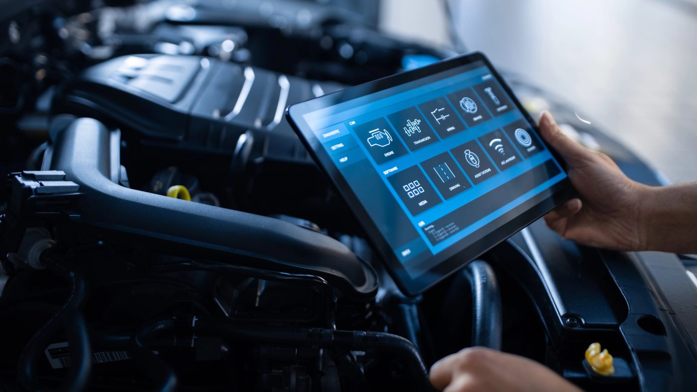 Running a diagnostic scan on a tablet at Elite Euro Performance in Norcross, GA